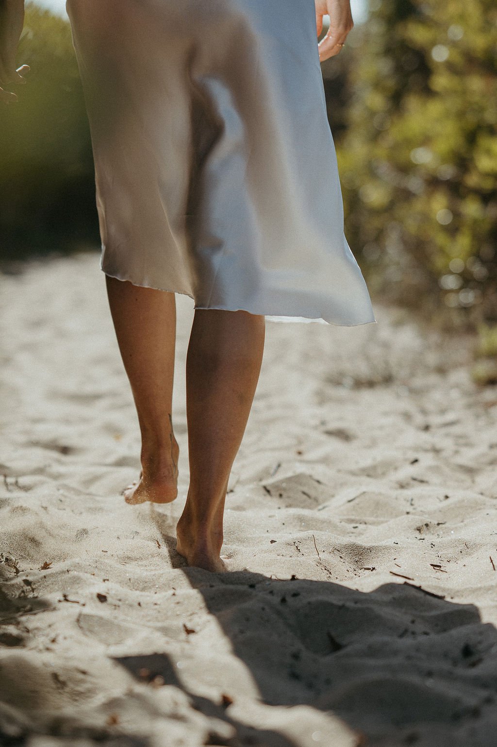 Walking barefoot on the sand